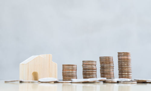 Close-up of stack of table against white background