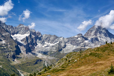 Scenic view of snowcapped mountains against sky