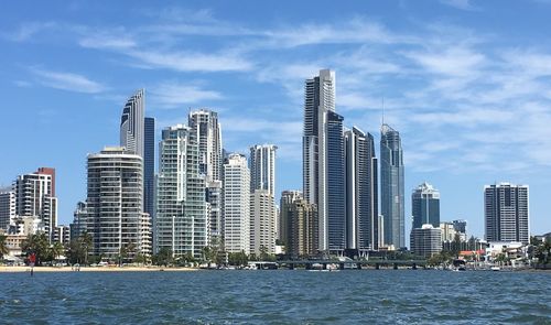 City skyline against cloudy sky