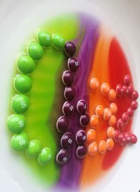 Close-up of multi colored candies on table