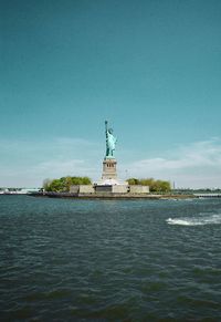 Statue of liberty with sea in background