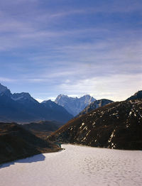 Scenic view of mountains against sky during winter