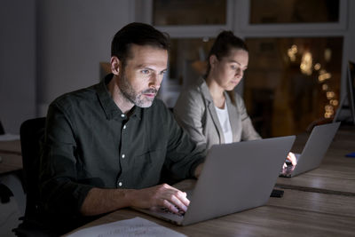 Business people working late in office