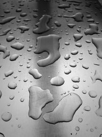 High angle view of raindrops on table