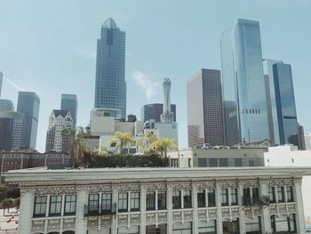 Low angle view of buildings against sky in city