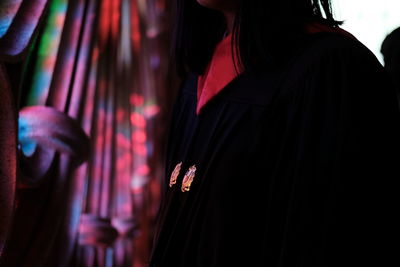 Low section of woman standing on cross