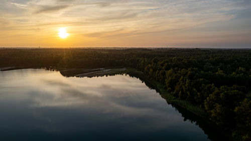 Scenic view of lake against sky during sunset