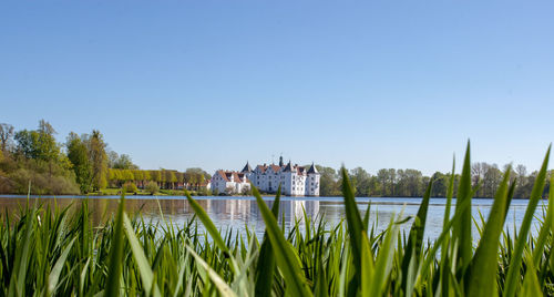 Scenic view of lake against clear sky