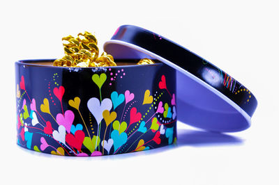 Close-up of colored pencils over white background