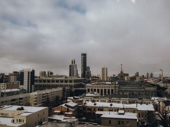 High angle view of buildings in city against sky