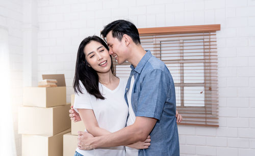 Young couple looking away