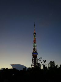 Low angle view of tower against blue sky