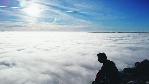 Silhouette of a man on mountain peak