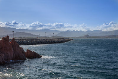 Sardinia coastline- rocks and cliffs near sea and tourists- italy