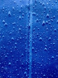 Close-up of raindrops on glass window