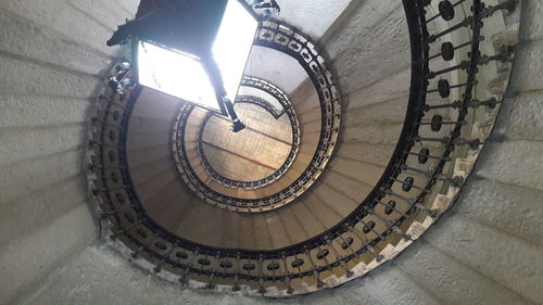 Directly below shot of spiral staircase of building