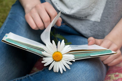 Close-up of woman hand holding book