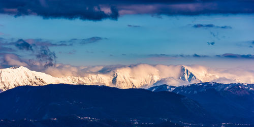 Scenic view of snowcapped mountains against sky