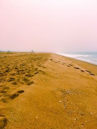 Scenic view of beach against clear sky