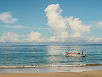 Boat in sea against sky