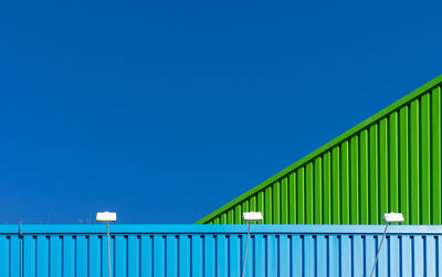 Low angle view of building against blue sky