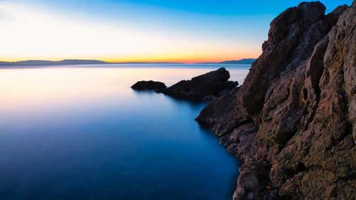 Scenic view of sea against sky during sunset