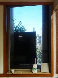 Reflection of trees on glass window