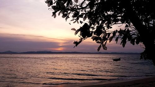 Scenic view of sea against sky at sunset