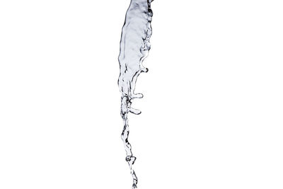 Close-up of water drop on white background