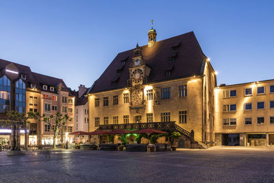 Buildings in city at night