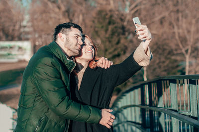 Rear view of man photographing