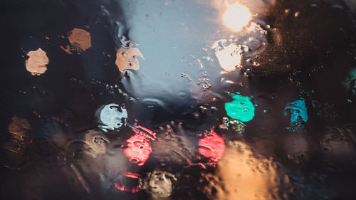 Full frame shot of wet glass window during rainy season