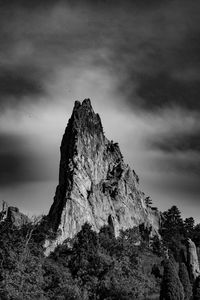 Low angle view of rock formation against sky