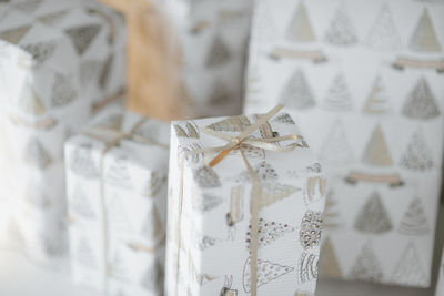 Close-up of christmas decorations hanging on paper