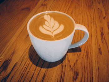 High angle view of coffee cup on table