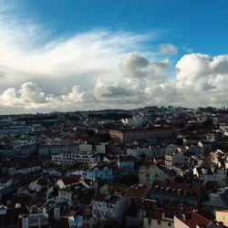Cityscape against cloudy sky