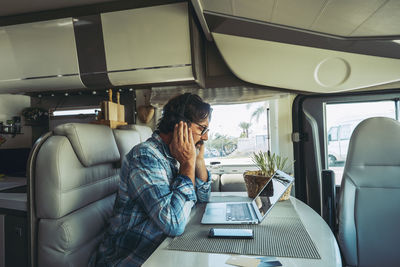 Mature man sitting in motor home