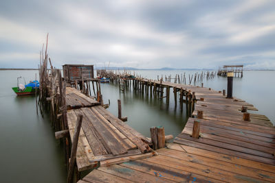 Pier over sea against sky