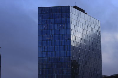 Low angle view of modern building against sky