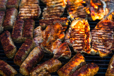 High angle view of meat on barbecue grill