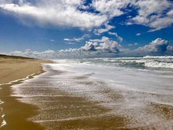 Scenic view of beach against sky