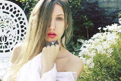 Portrait of beautiful woman with flowers