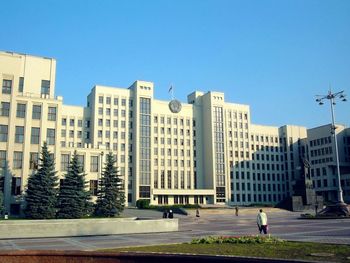 Modern buildings against clear blue sky