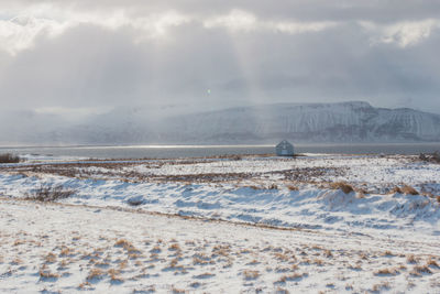 Scenic view of sea against sky during winter