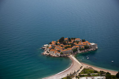 High angle view of sea and buildings in city