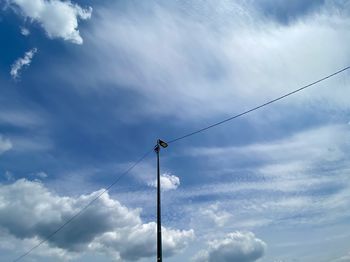 Low angle view of street light against sky