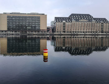 Reflection of building in puddle