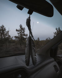 Close-up of rope hanging in car