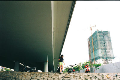 Woman standing in front of building