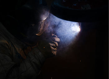 Midsection of man standing in cave